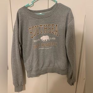 Gray Crewneck Sweatshirt with writing. Size large, runs small.